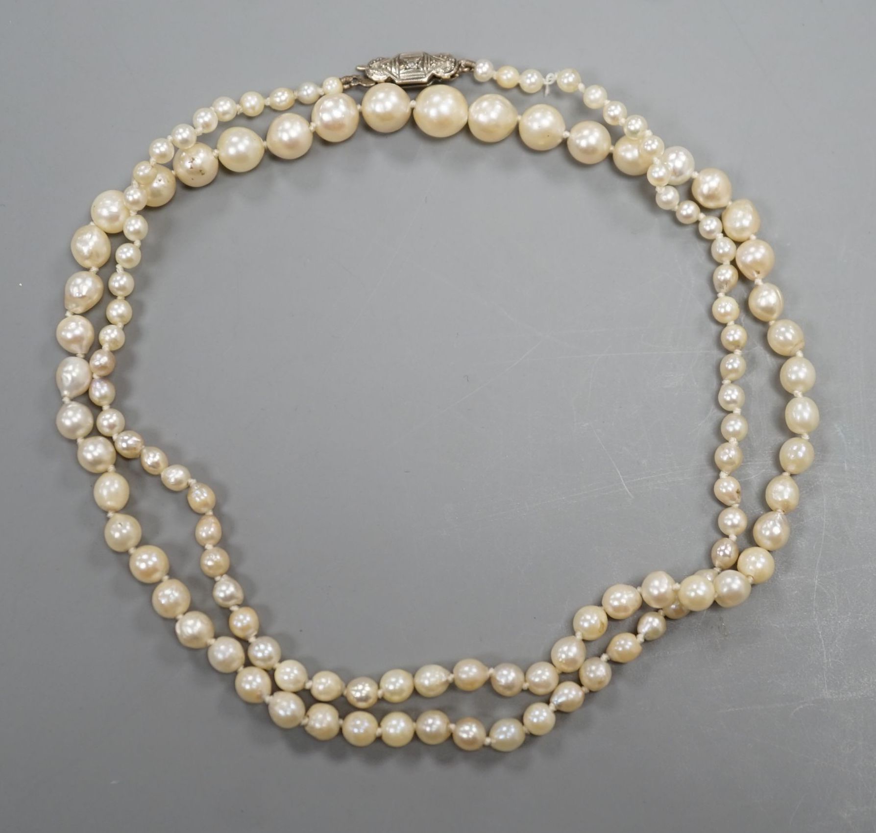 A single strand graduated cultured pearl necklace, with diamond chip set white metal clasp, 54cm, gross weight 13 grams.